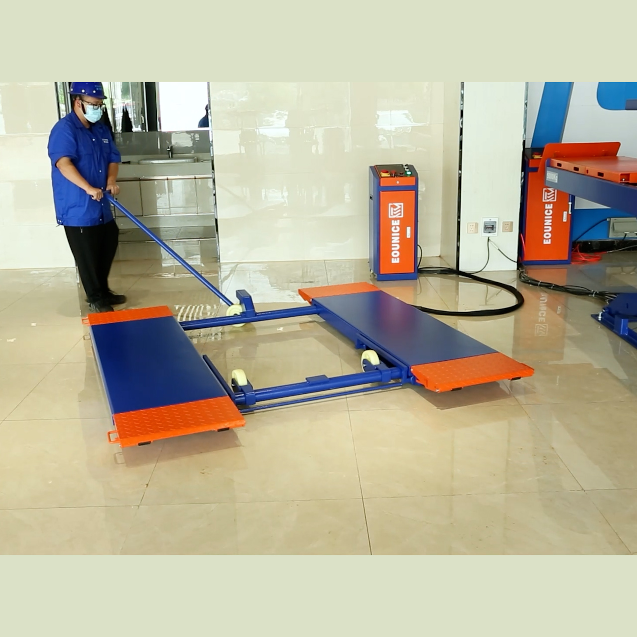 High-performance Eounice 3-ton portable scissor lift equipment deployed in an auto body shop for collision repair and paint prep.